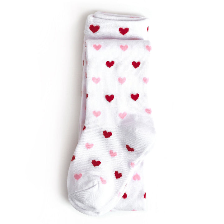 girl's white knit tights with pink and red heart pattern for Valentine's day 