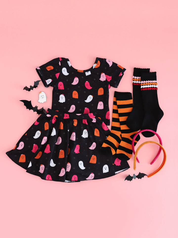 girls' matching skort and fitted top in black with all-over pink and orange ghost print paired with Halloween knee highs, ghost clip and velvet headbands