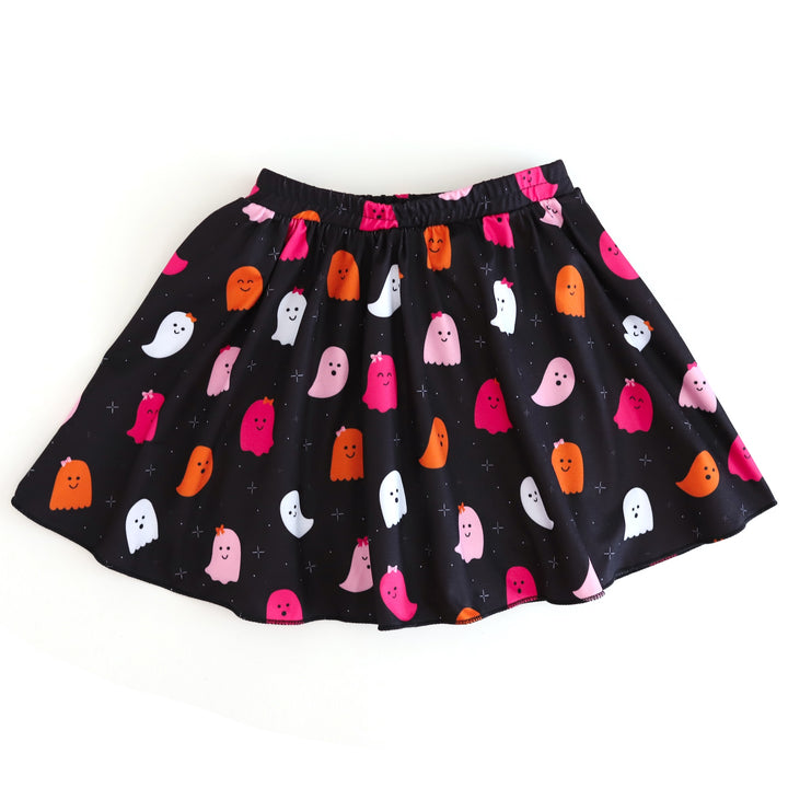 girl's black Halloween skort with pink and orange ghost print and built in black shorts