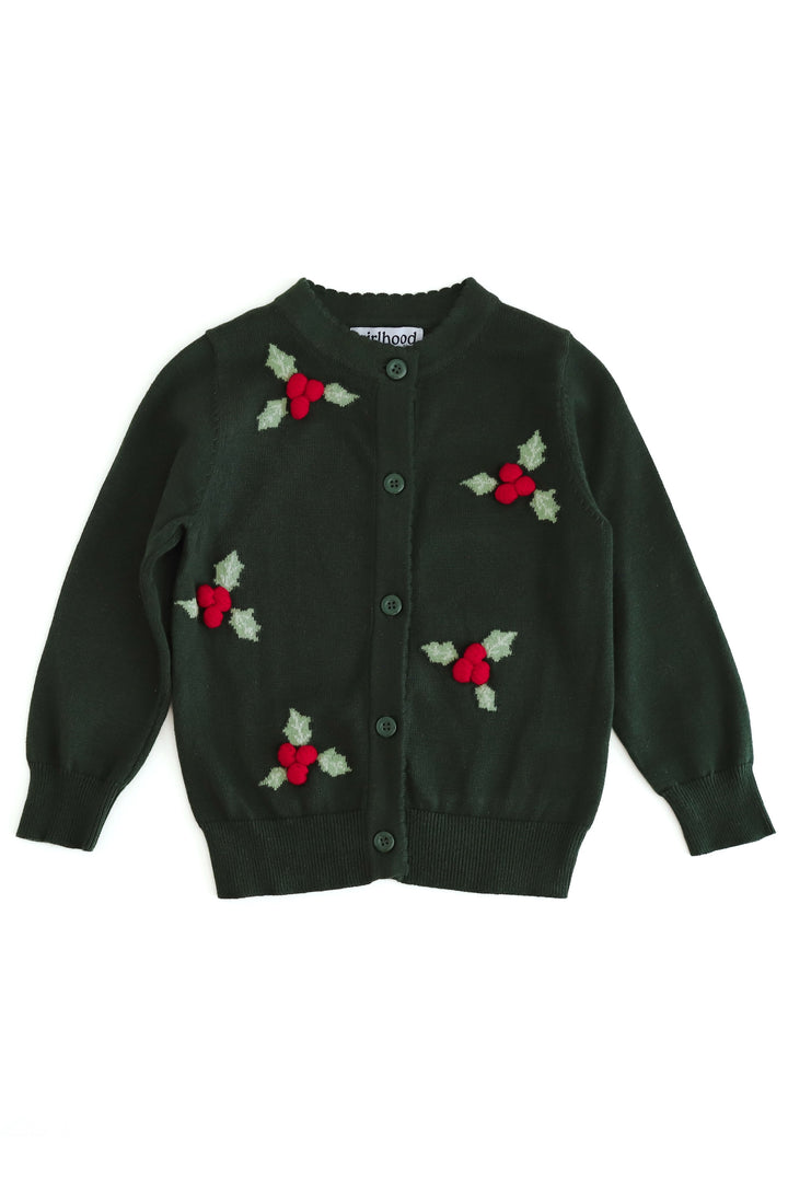 A dark green knit cardigan sweater with knit holly leaves and 3d red berries, featuring a button-up front and scalloped collar and placket. Ribbed cuffs, and hem.