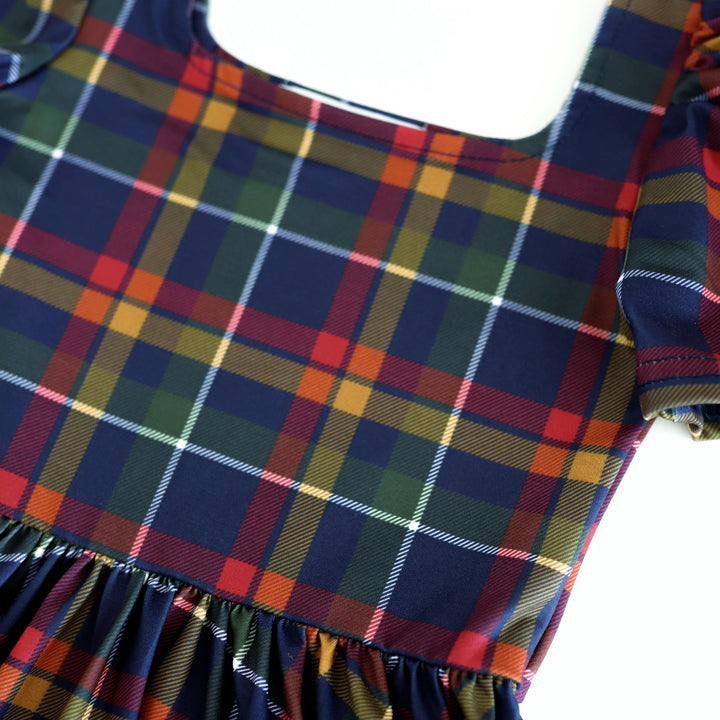 close up of girls' navy, yellow, red and white plaid twirl dress print for school