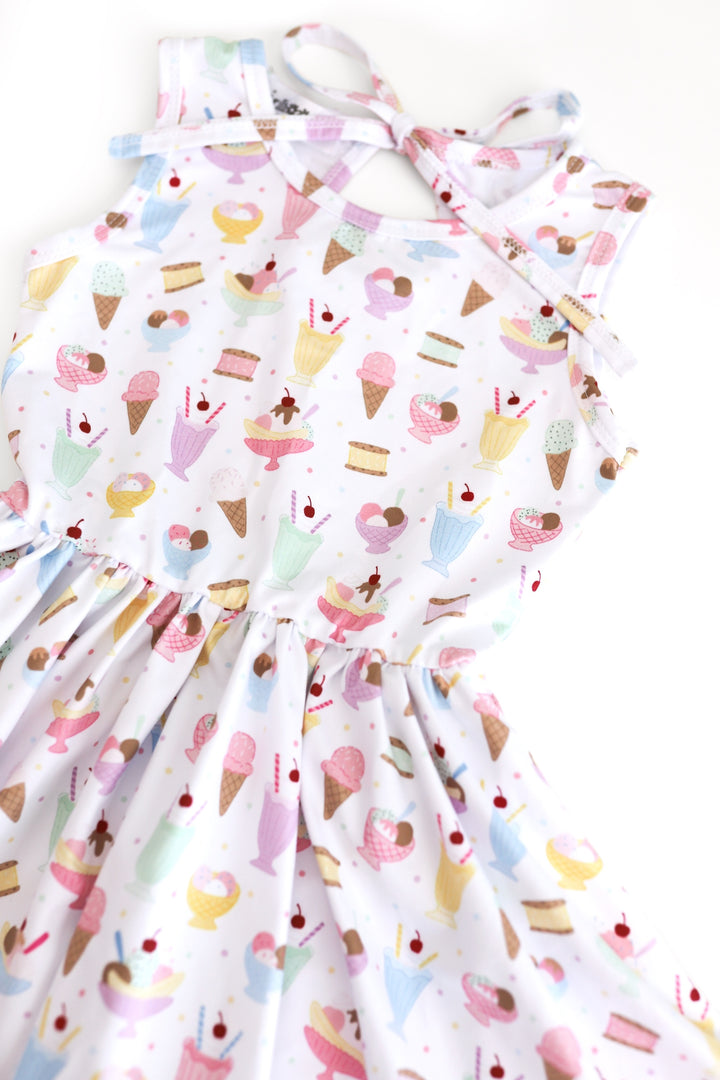 detail photo of girls sleeveless twirl dress in white with pastel ice cream print