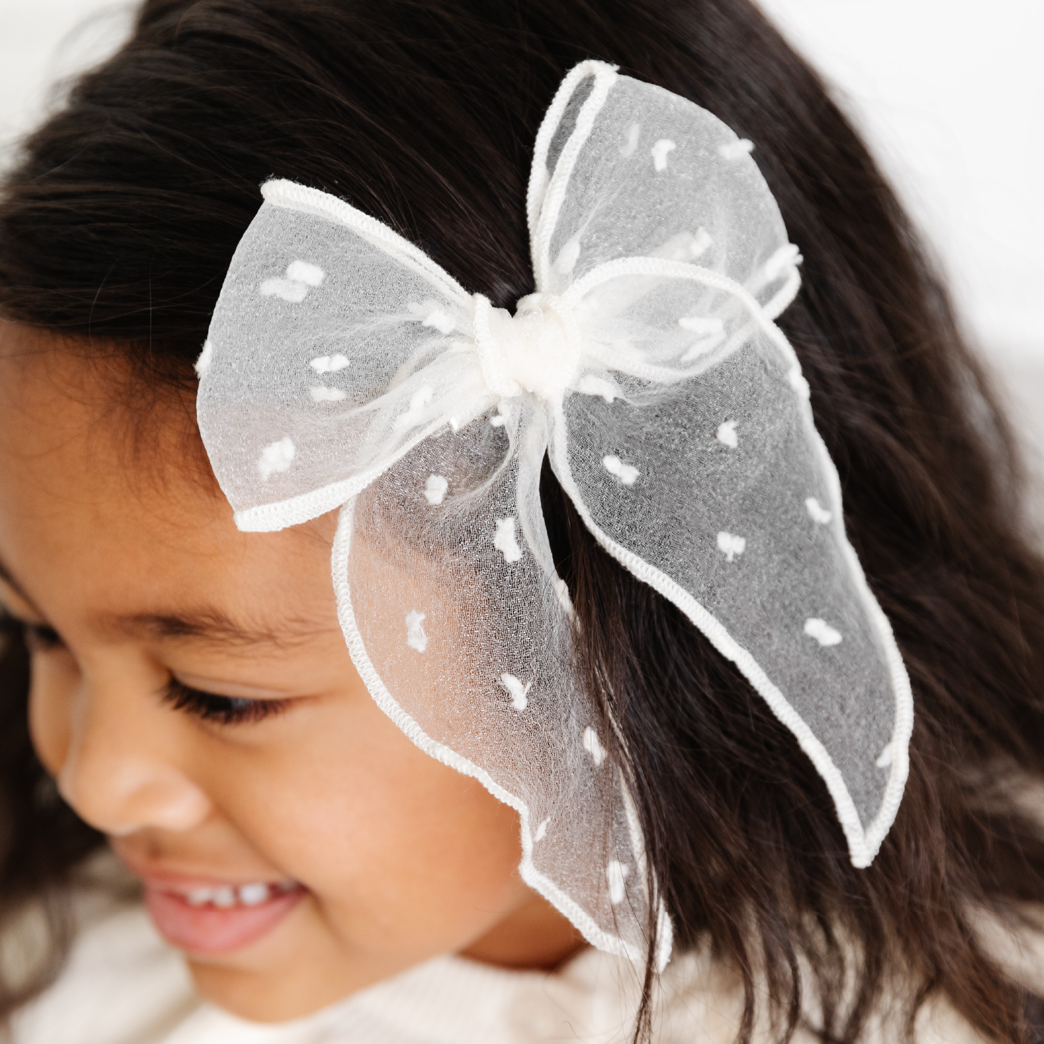 girl wearing ivory cream sheer mesh dot fabric hair bow