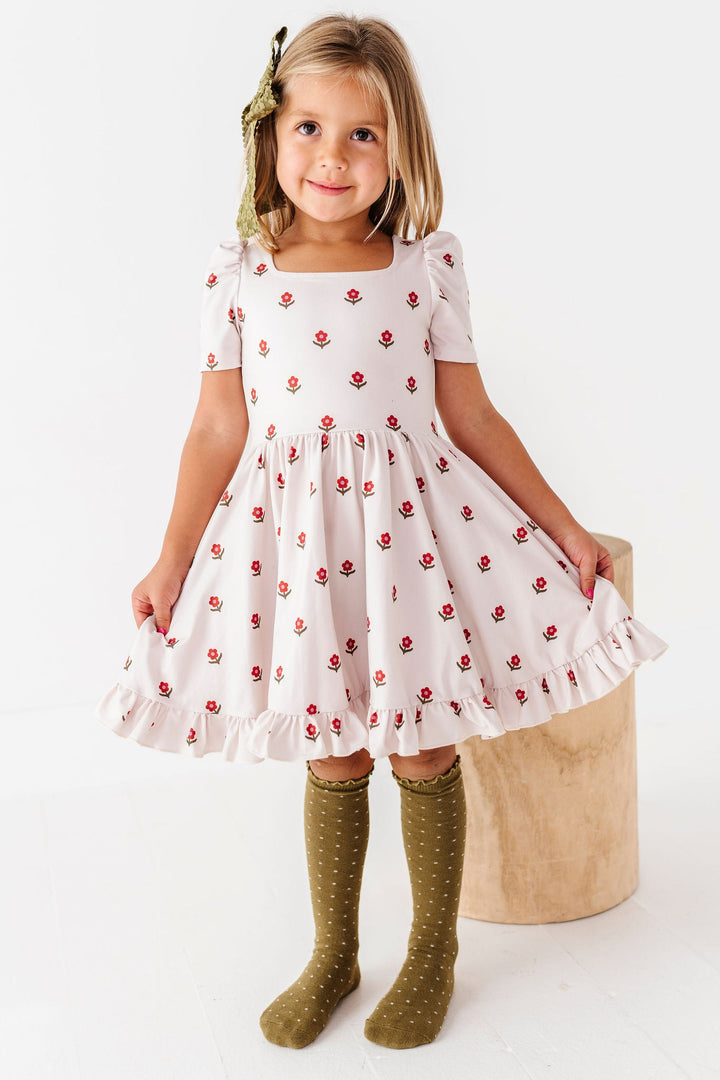 girl wearing ivory dress with little flower print