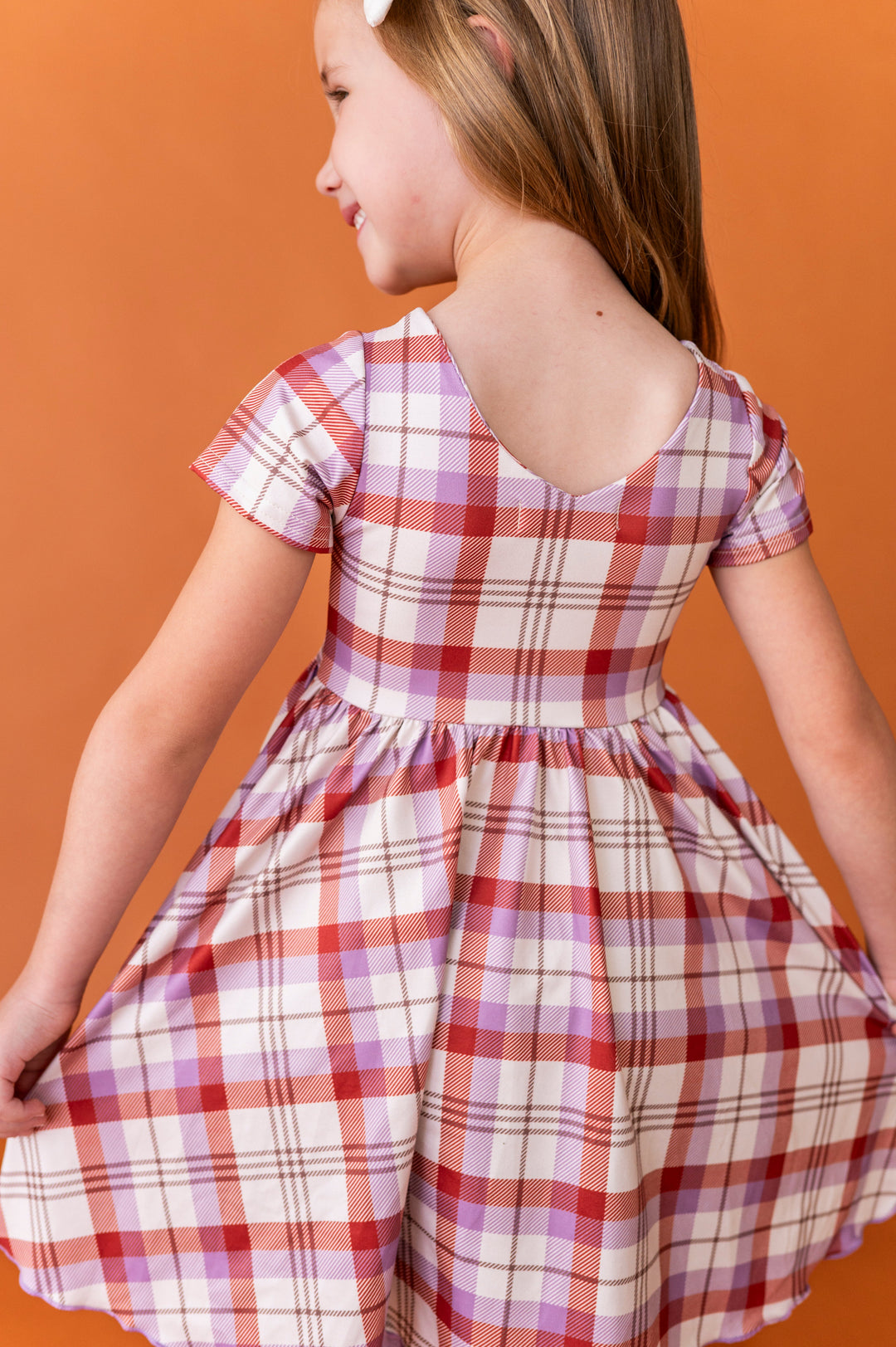 back view little girl v-neck twirl dress in ivory plaid for fall