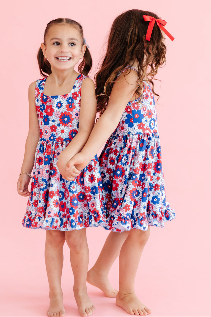 girls in matching sleeveless floral 4th of july summer twirl dresses