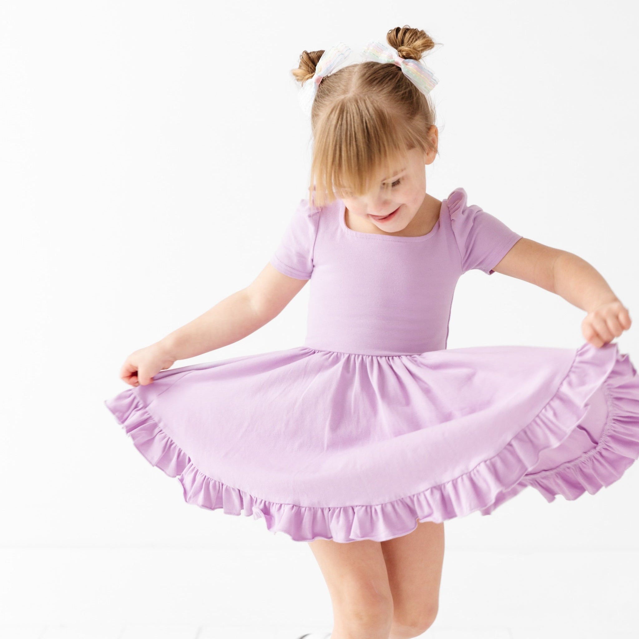 girl twirling in lavender purple square neck short sleeve dress