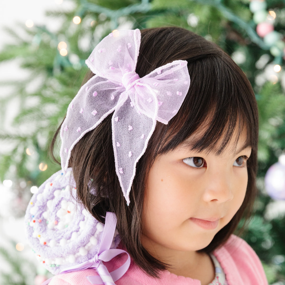 girls wearing lavender purple sheer dot bow with sparkle trim by christmas tree