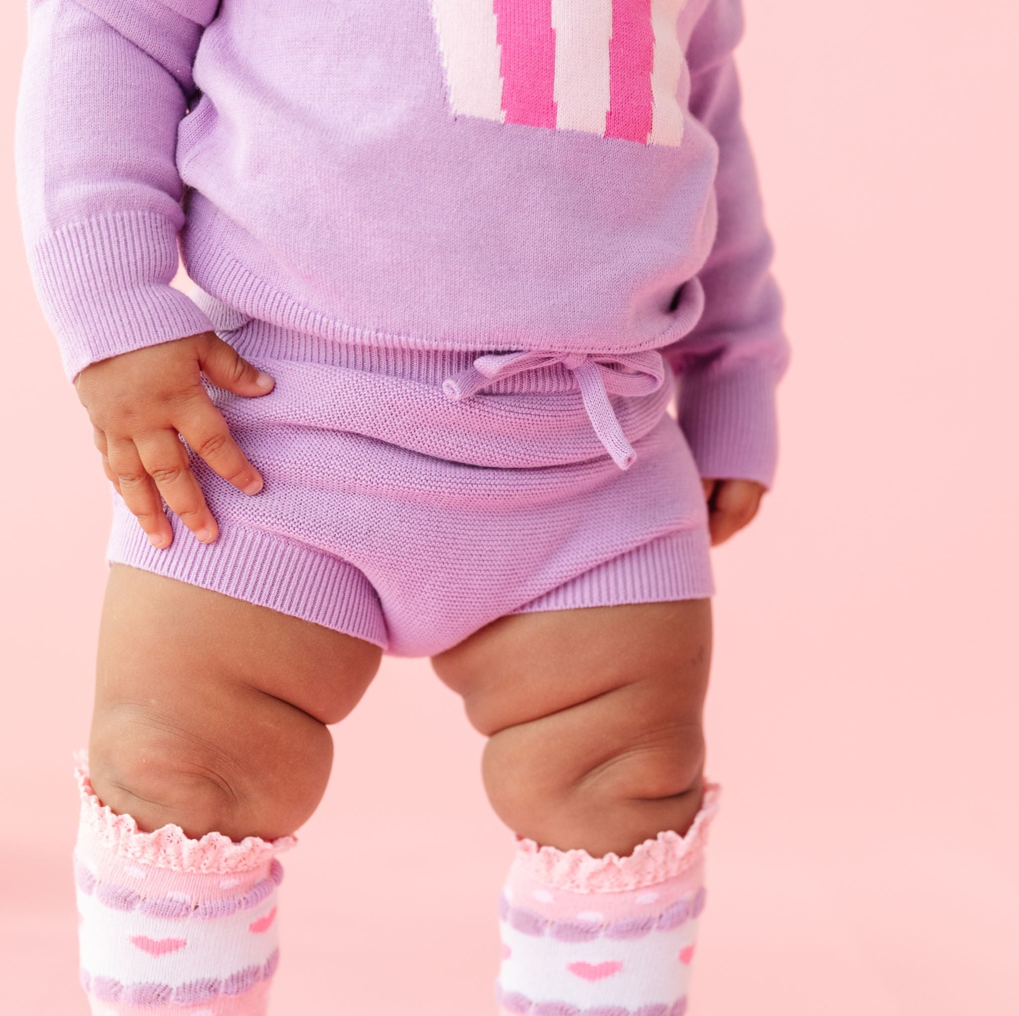 detail photo of lavender cotton knit baby bloomers with faux tie paired with cupcake sweater and pink valentine's themed knee highs