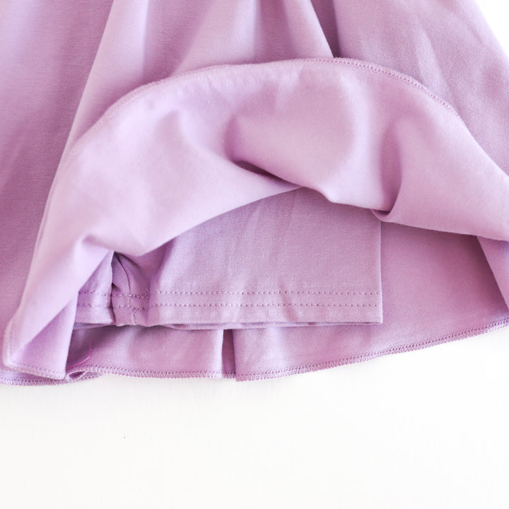 closeup of cotton knit lavender fitted shorts attached to girls' spring skort
