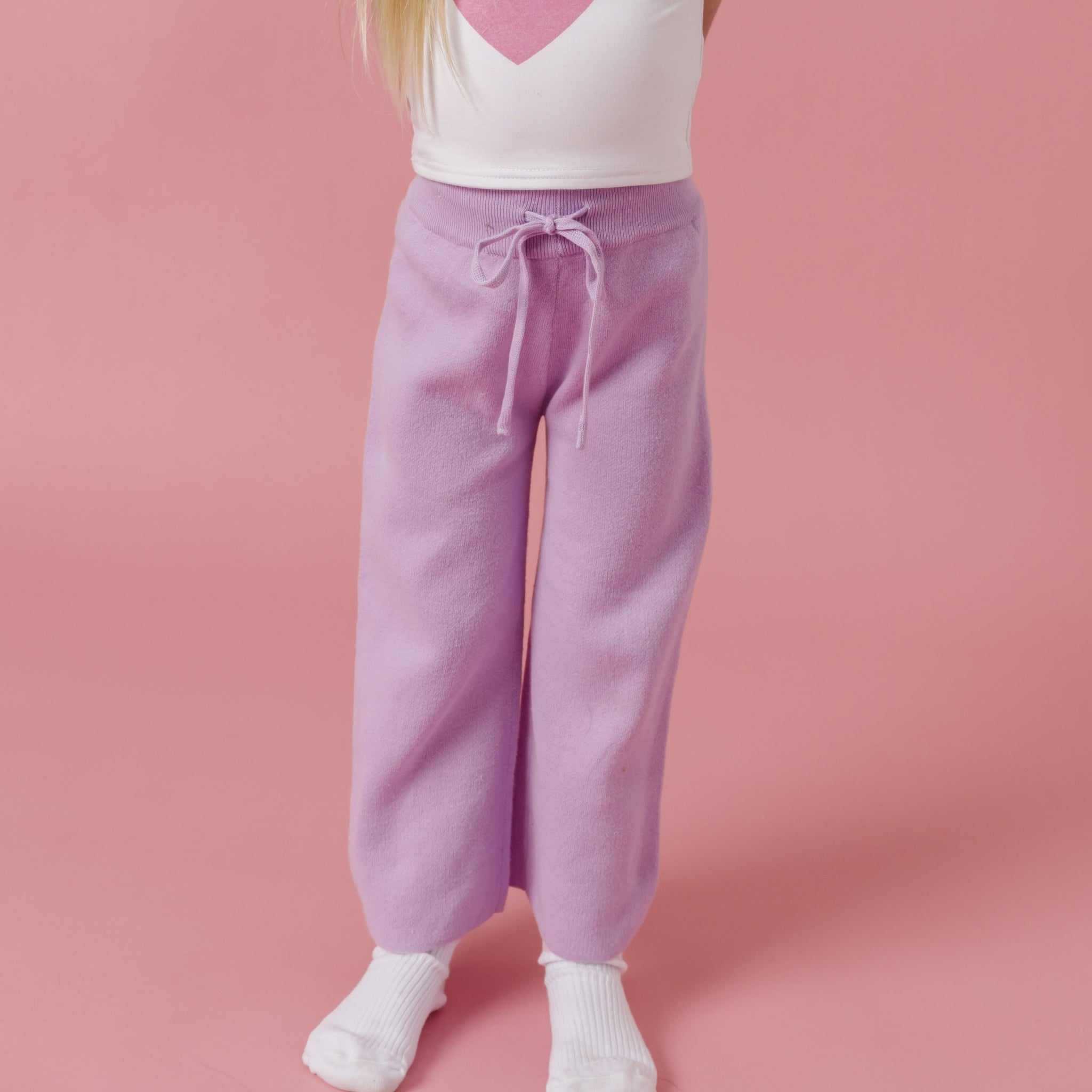 little girl in light purple cotton knit sweater pants with drawstring waistband for Valentine's day and spring