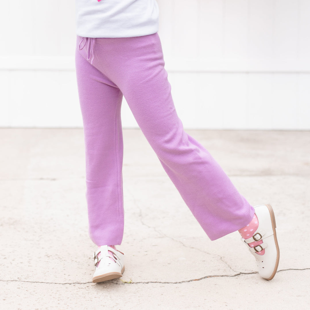 detail photo of little girl in lavender cotton knit sweater pants with matching sweater and dot socks