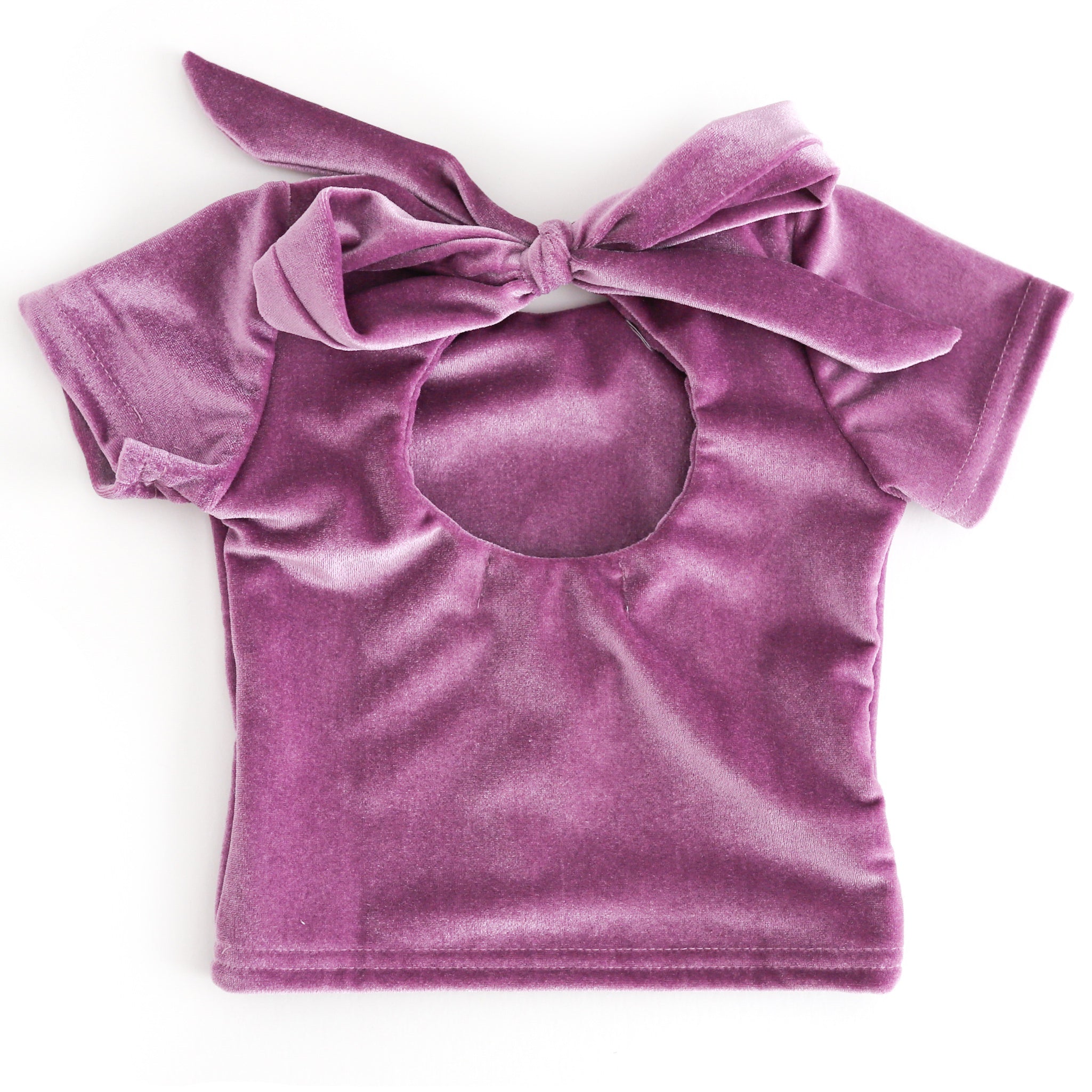 back view of girl velvet charm top with keyhole opening ties with oversized bow
