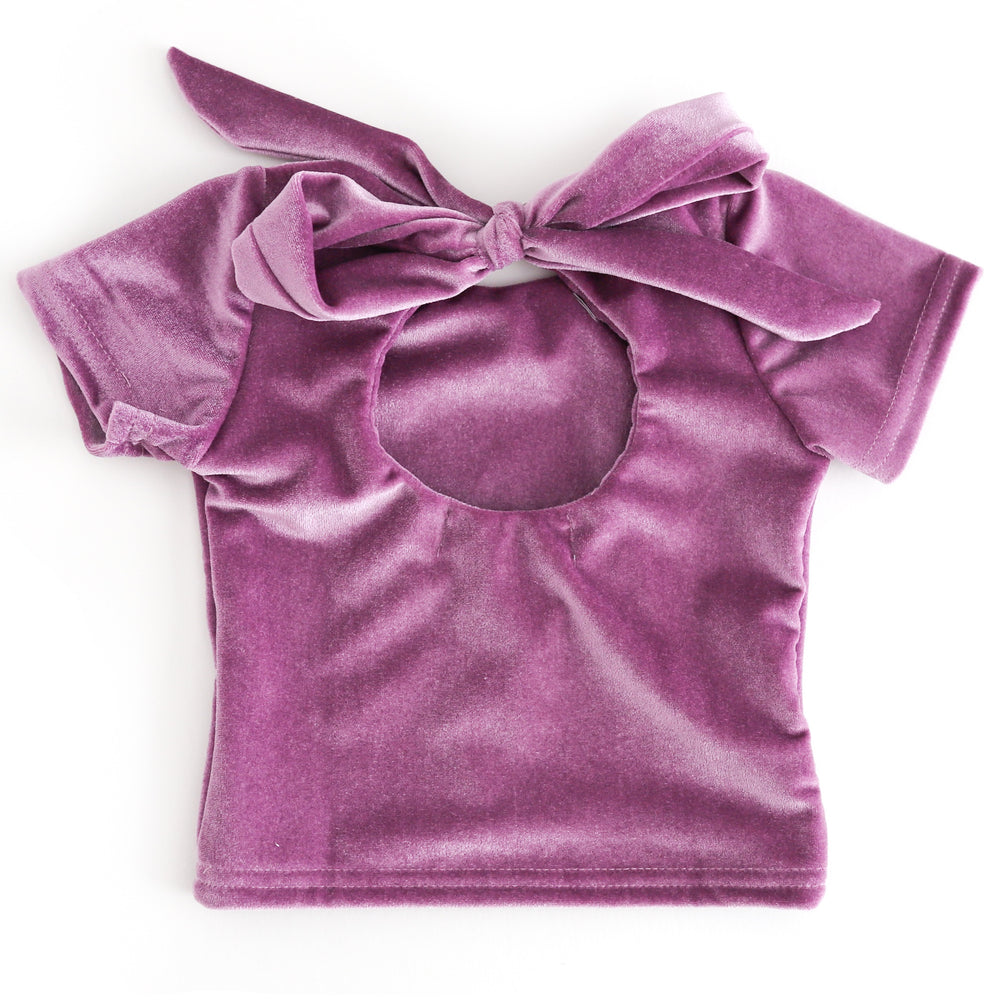 back view of girl velvet charm top with keyhole opening ties with oversized bow