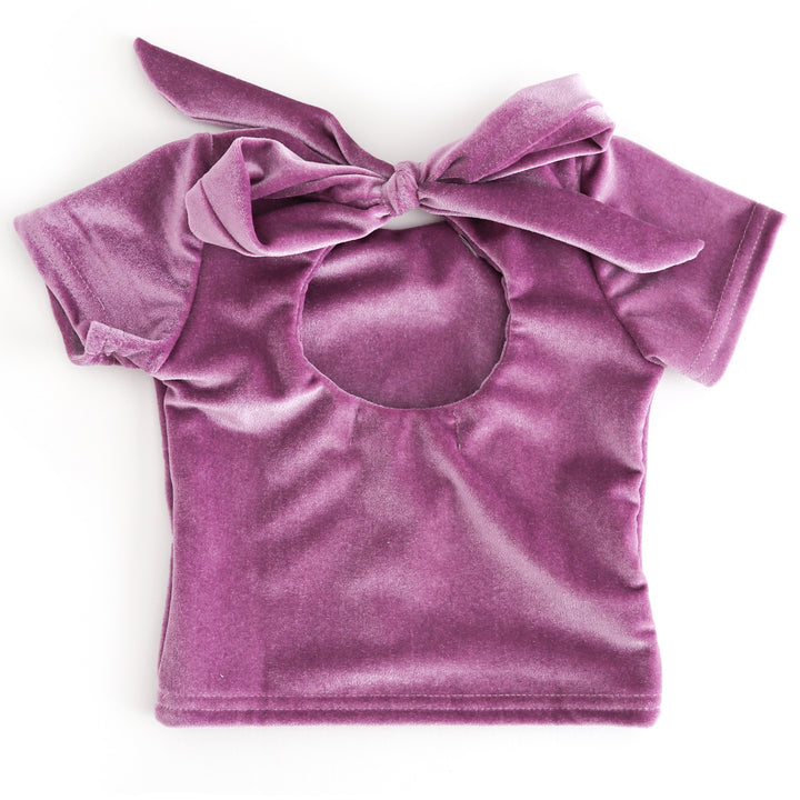 back view of girl velvet charm top with keyhole opening ties with oversized bow