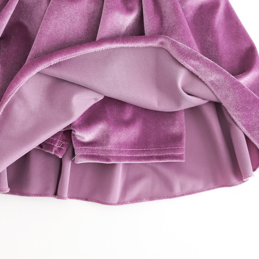 closeup of lavender velvet biker shorts attached to girls' matching velvet skort