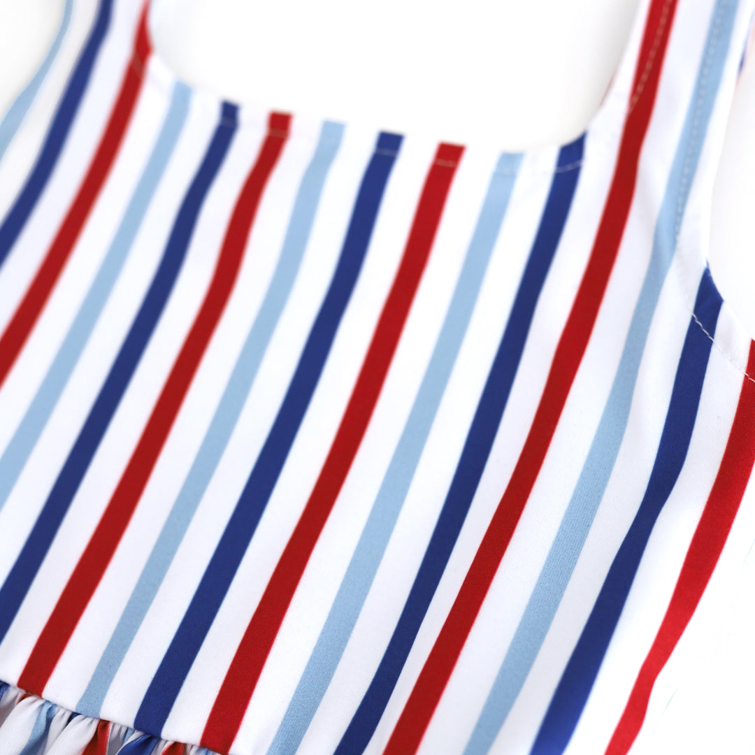 close up of red, white, dark blue and light blue stripes on fourth of July twirl dress bodice