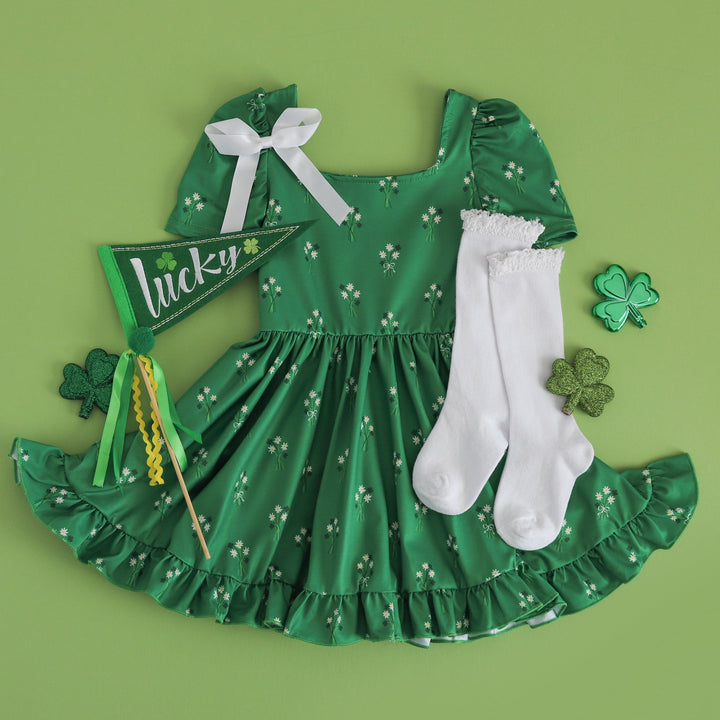 St. Patrick's Day green square neck twirl dress with daisy print paired with white lace top knee socks and white satin ribbon bow 
