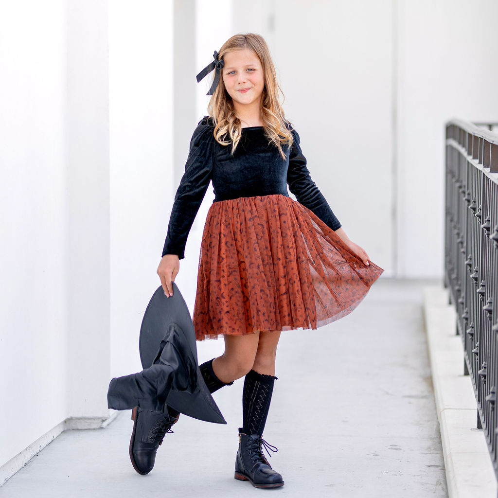 girl in halloween witch dress