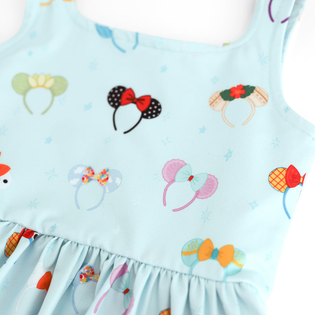 close up of character inspired magical mouse ear print on light blue twirl dress 