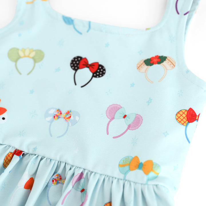 close up of character inspired magical mouse ear print on light blue twirl dress 