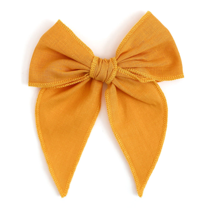 girls' linen hair bow in marigold yellow