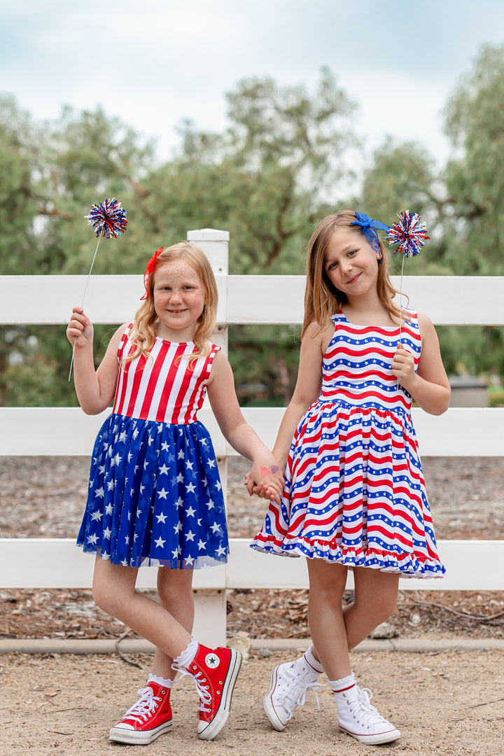 two friends in red, white and blue stars and stripes 4th of july dresses for girls