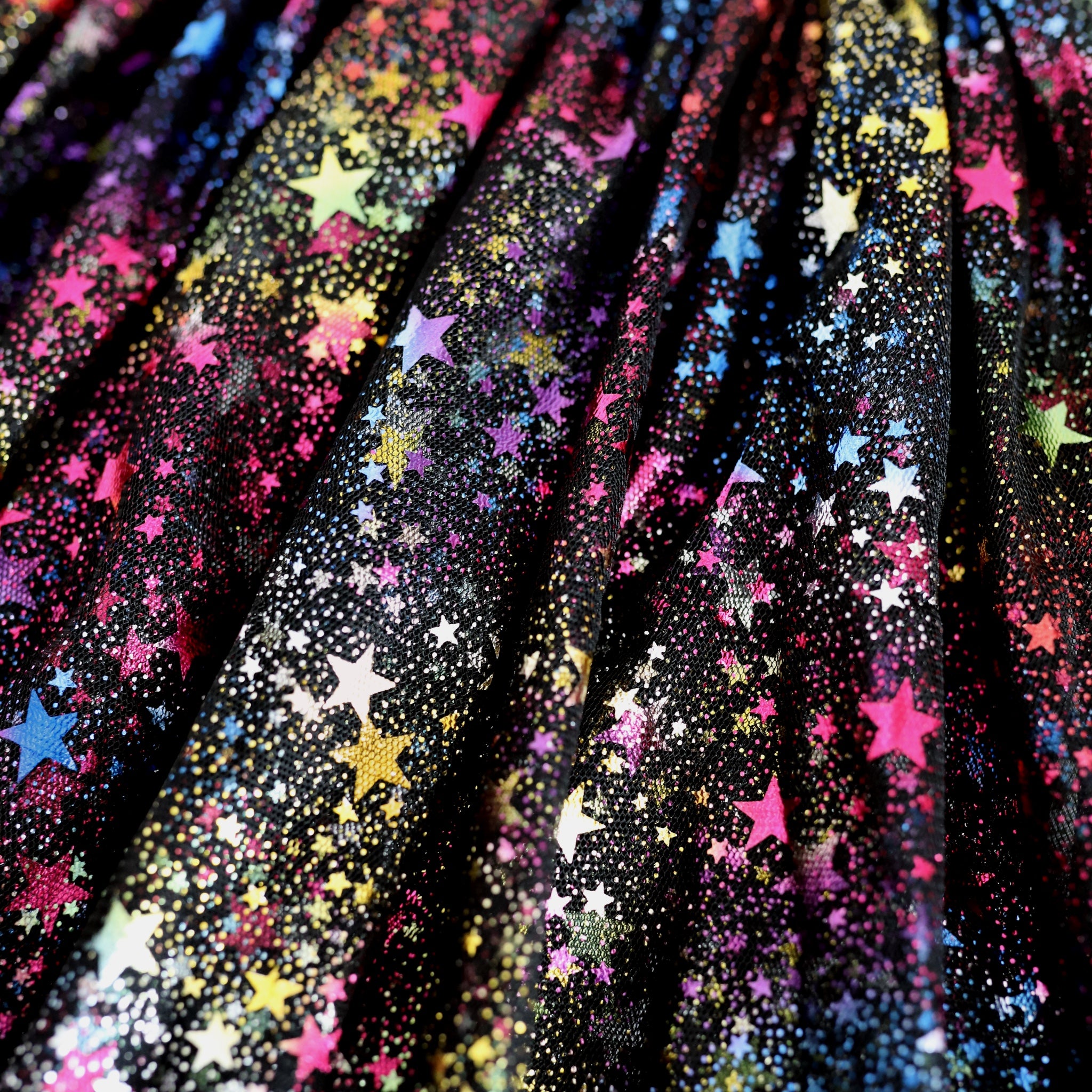 detail photo of black tulle and rainbow metallic stars fabric of girls tutu skort