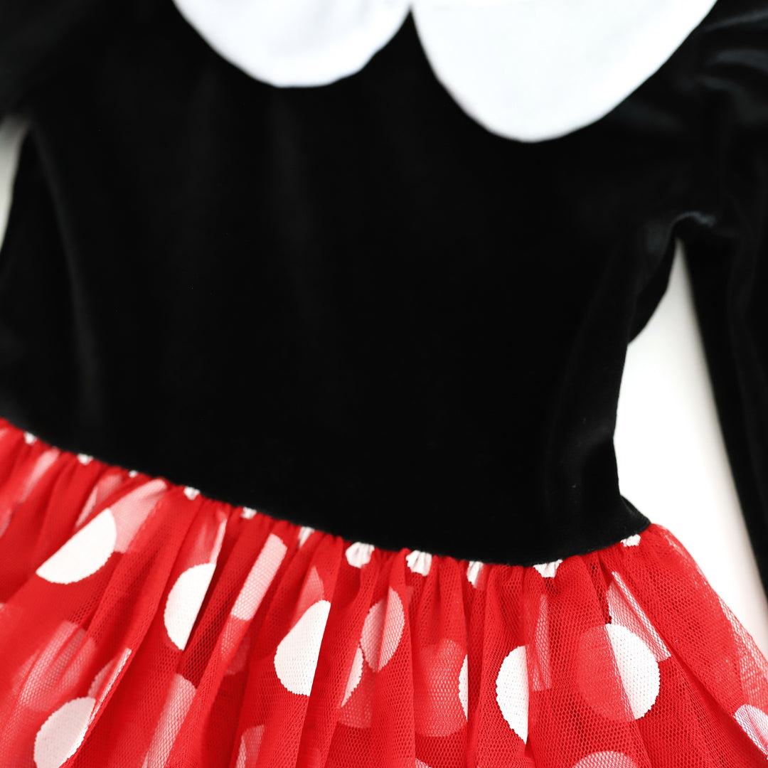 closeup of black velvet bodice, white colla and attached red and white polka dot tulle skirt