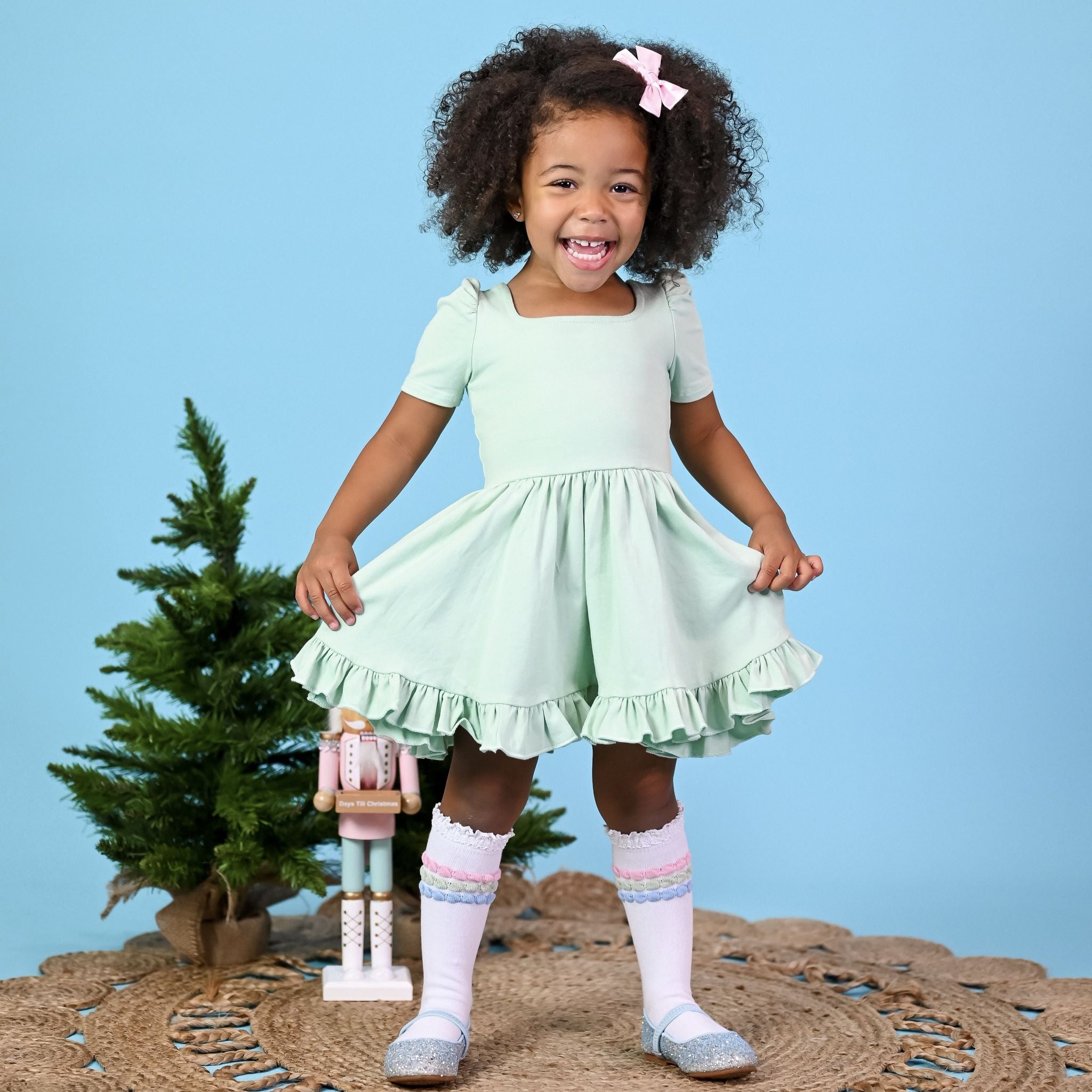 little girl wearing mint green dress for pastel christmas outfit