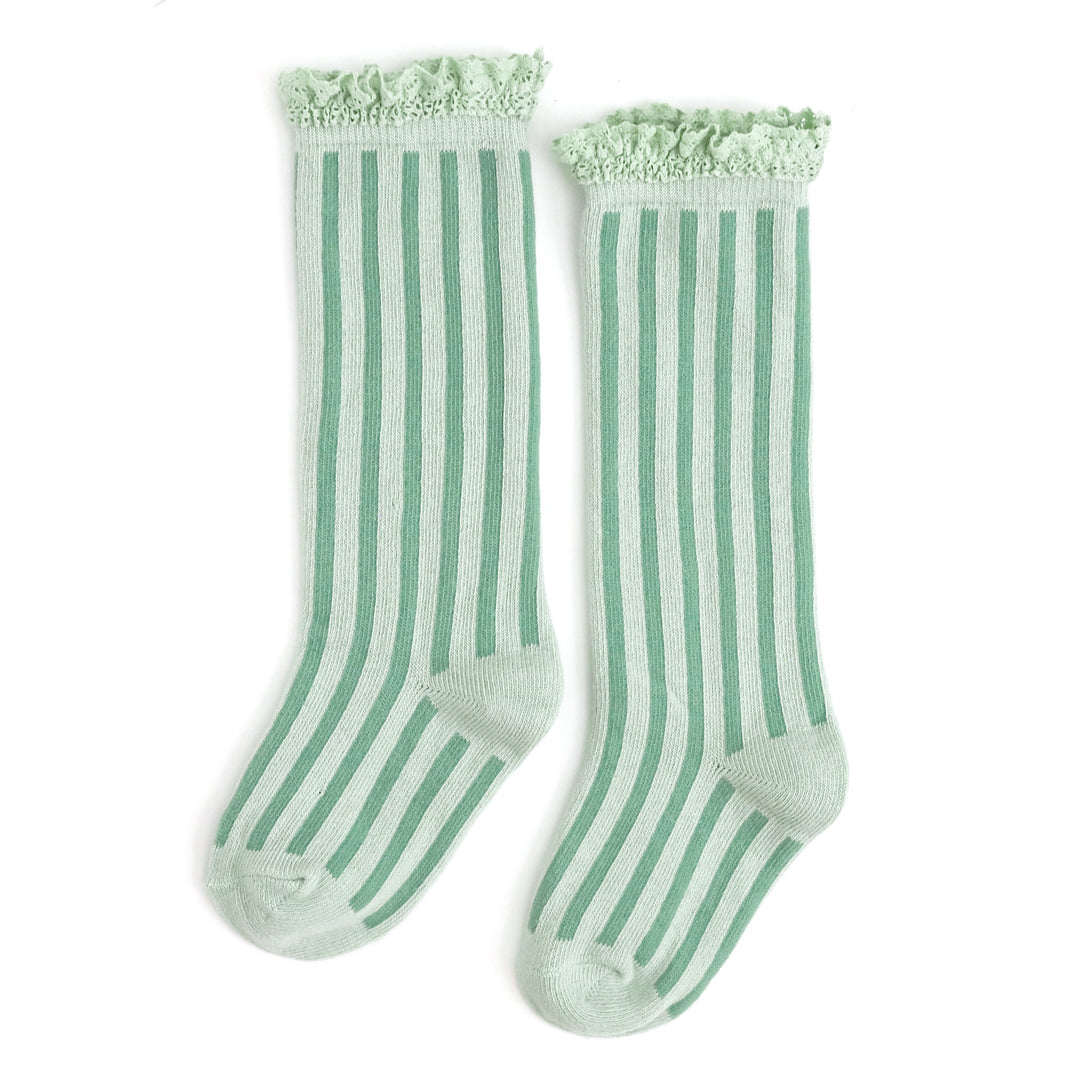 little girls pastel green knee highs with two tone vertical stripes for pastel holiday vibes