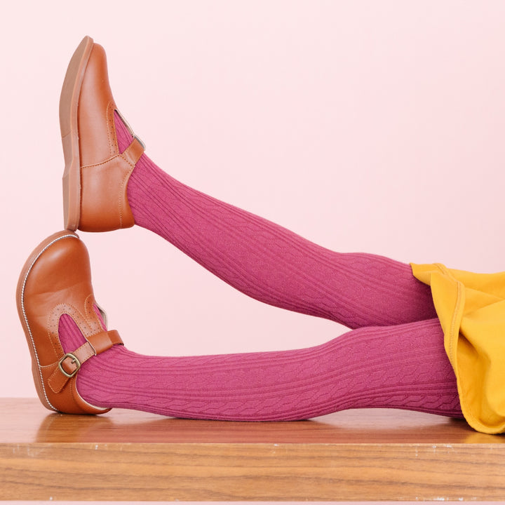 girls mulberry pink cable knit tights with brown leather shoes and yellow dress