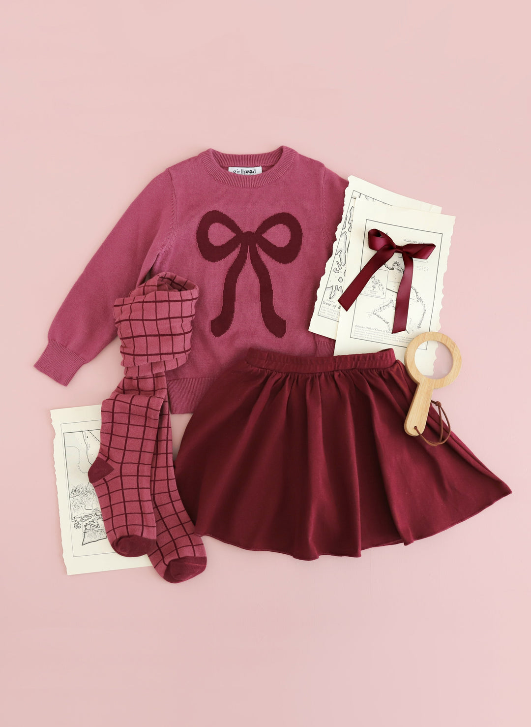 girls' cotton knit sweater in mulberry with burgundy bow design paired with burgundy skort, bow and grid tights