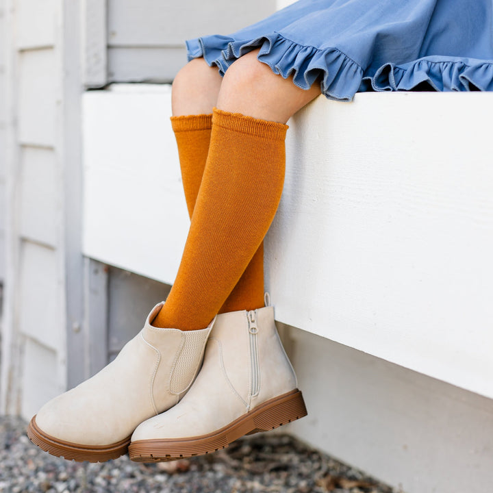 girls mustard knit knee highs with scalloped border paired woth denim blue twirl