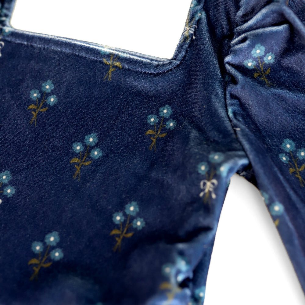print close-up of square neckline on navy floral velvet twirl dress for fall