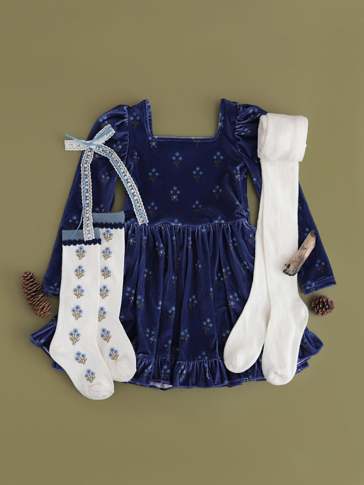 girls' outfit inspo for fall family photos featuring navy velvet floral twirl dress with long puffed sleeves and matching accesories