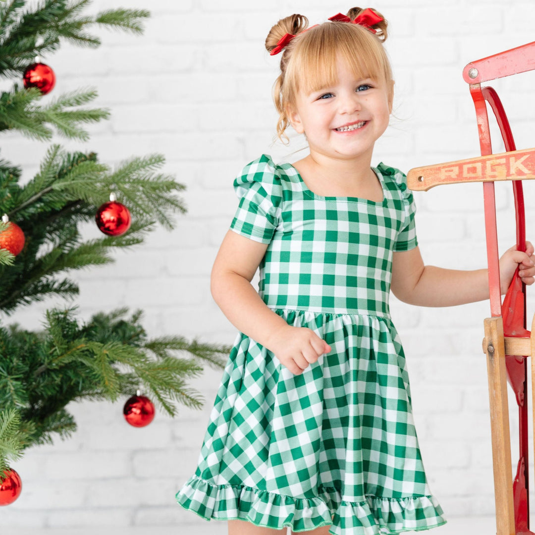 girls green gingham christmas dress with red satin hair bows and red knee high socks