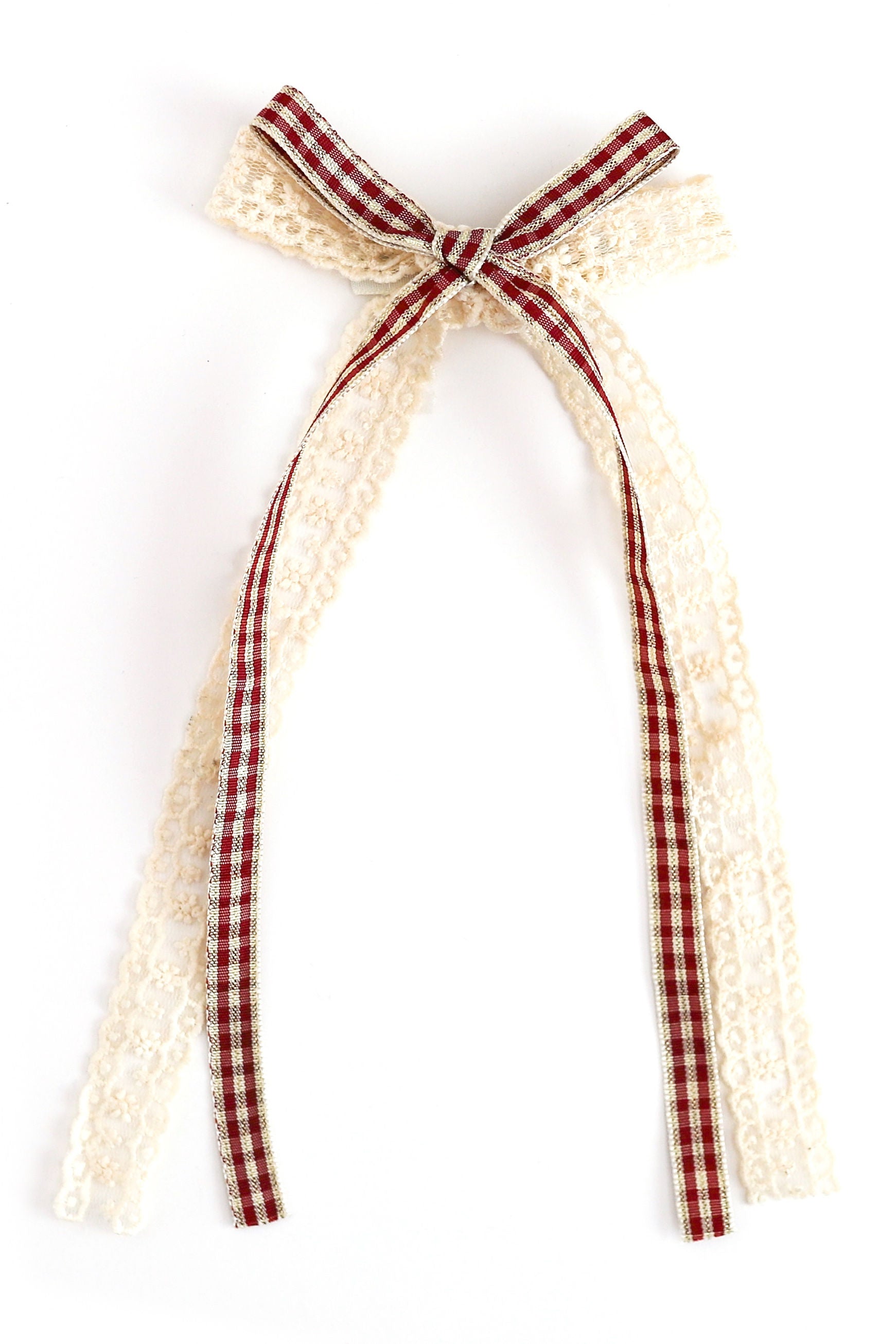 christmas hair bow with vanilla lace and crimson plaid ribbon shown on white background