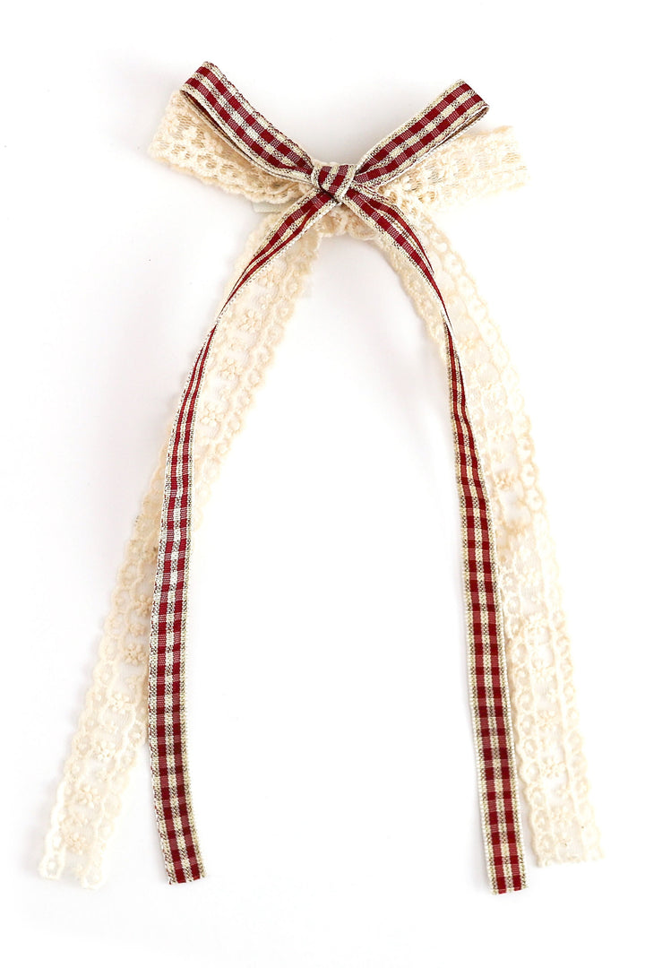 christmas hair bow with vanilla lace and crimson plaid ribbon shown on white background