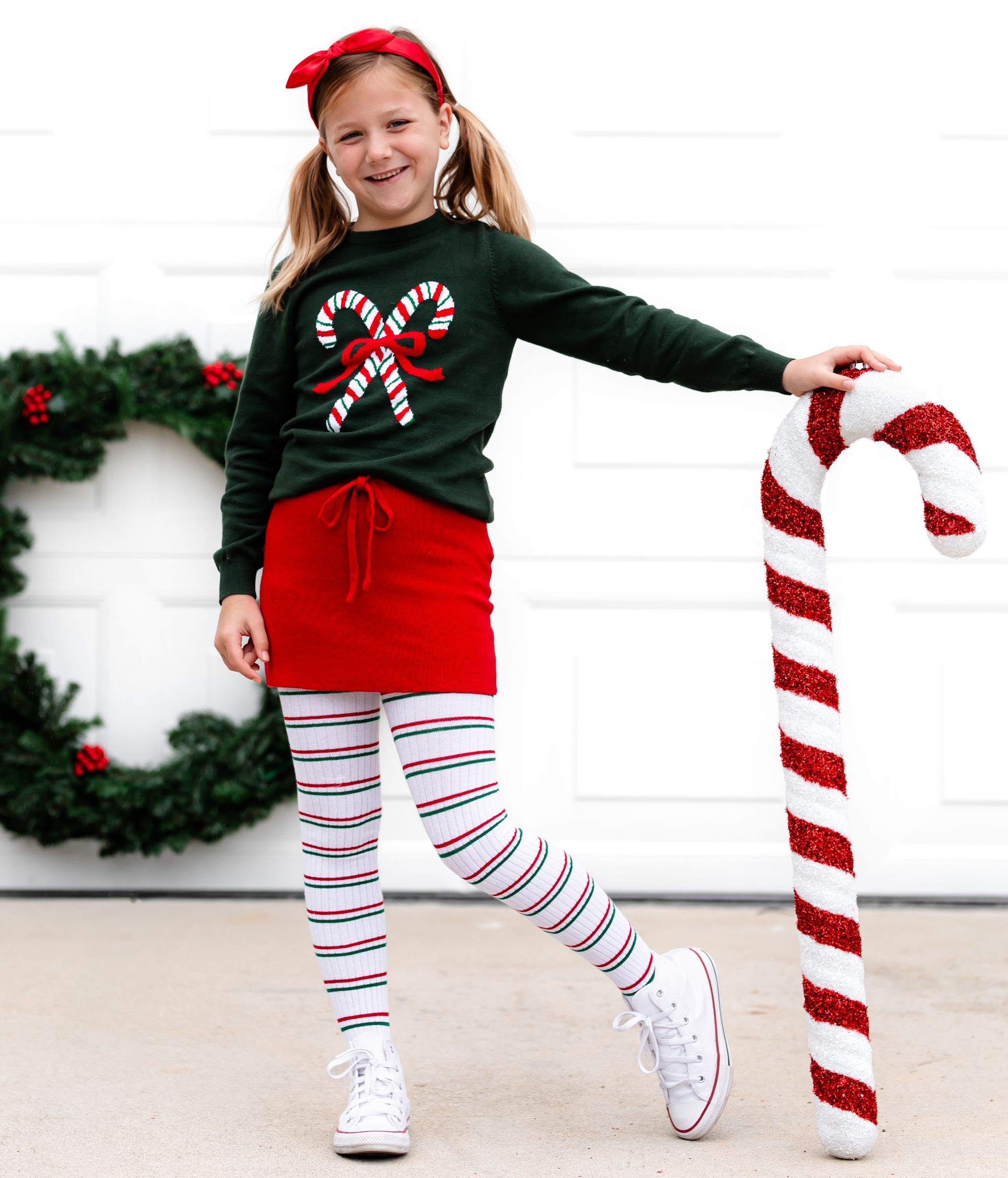 girls candy cane sweater outfit with knit skirt and candy cane stripe tights