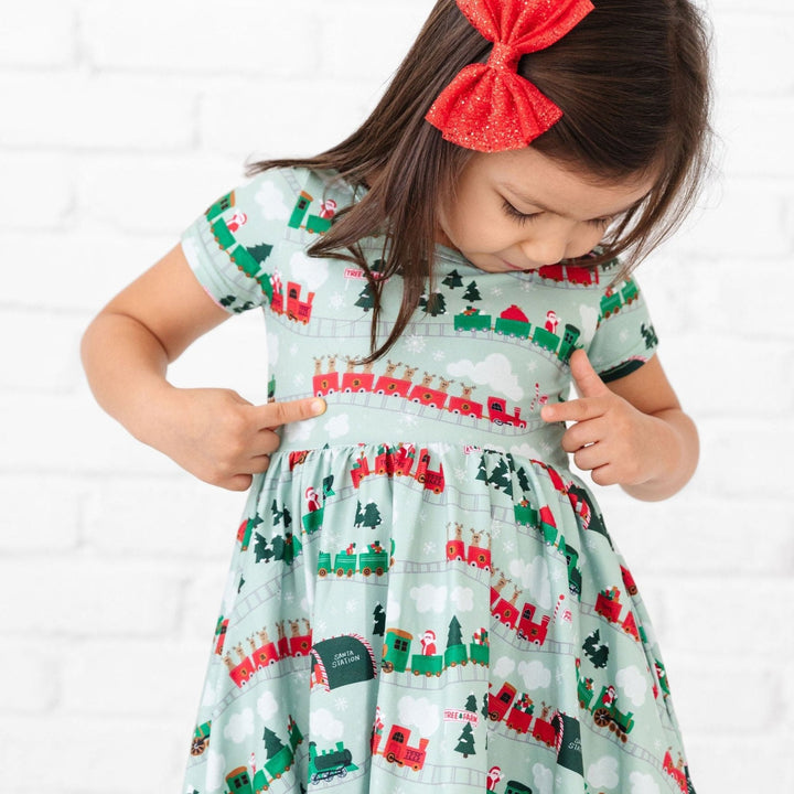 little girls christmas train print dress with matching accessories