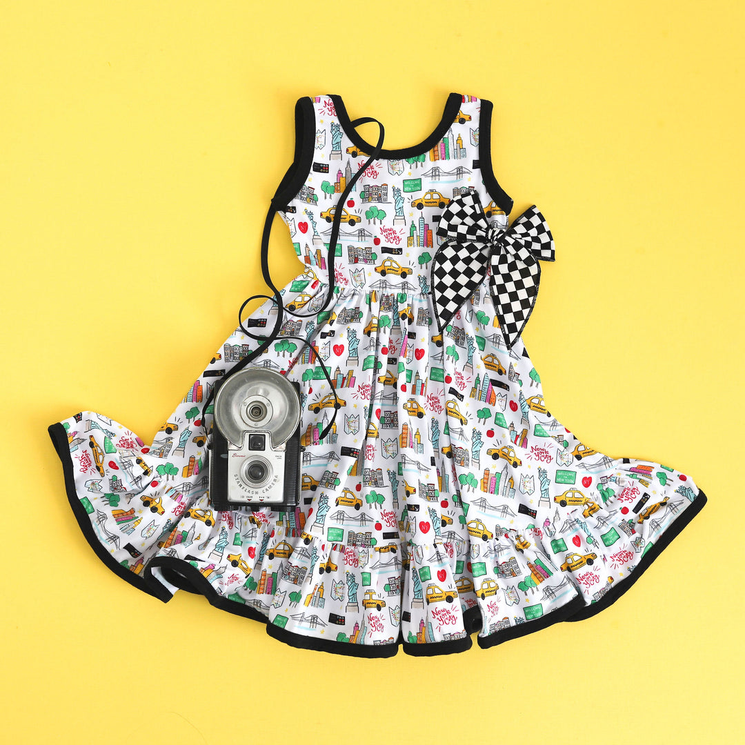 nyc inspired girls summer dress paired with black and white checkered bow