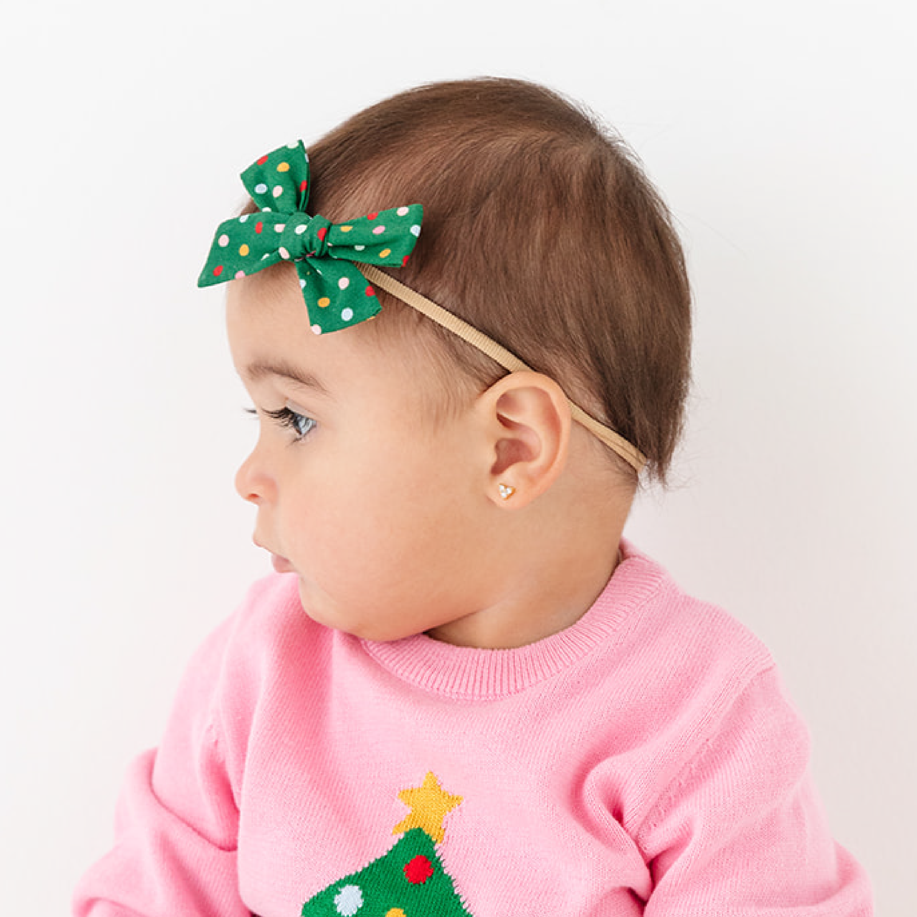 baby girl in Christmas dot baby bow on nylon band and matching knit sweater