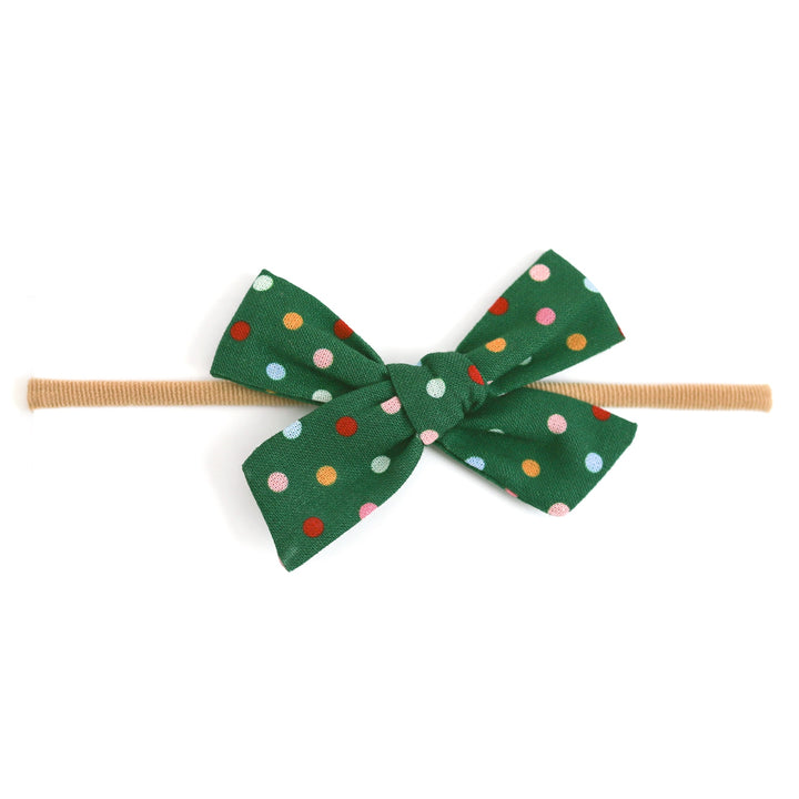 Green polka dot Christmas bow on soft nylon band for baby girl 