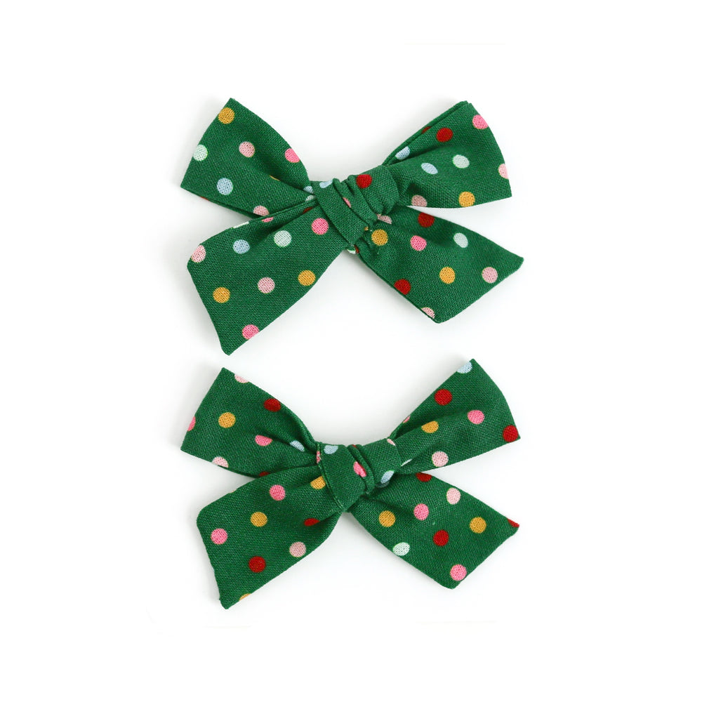 set of green Christmas pigtail bows with colorful dots for little girls