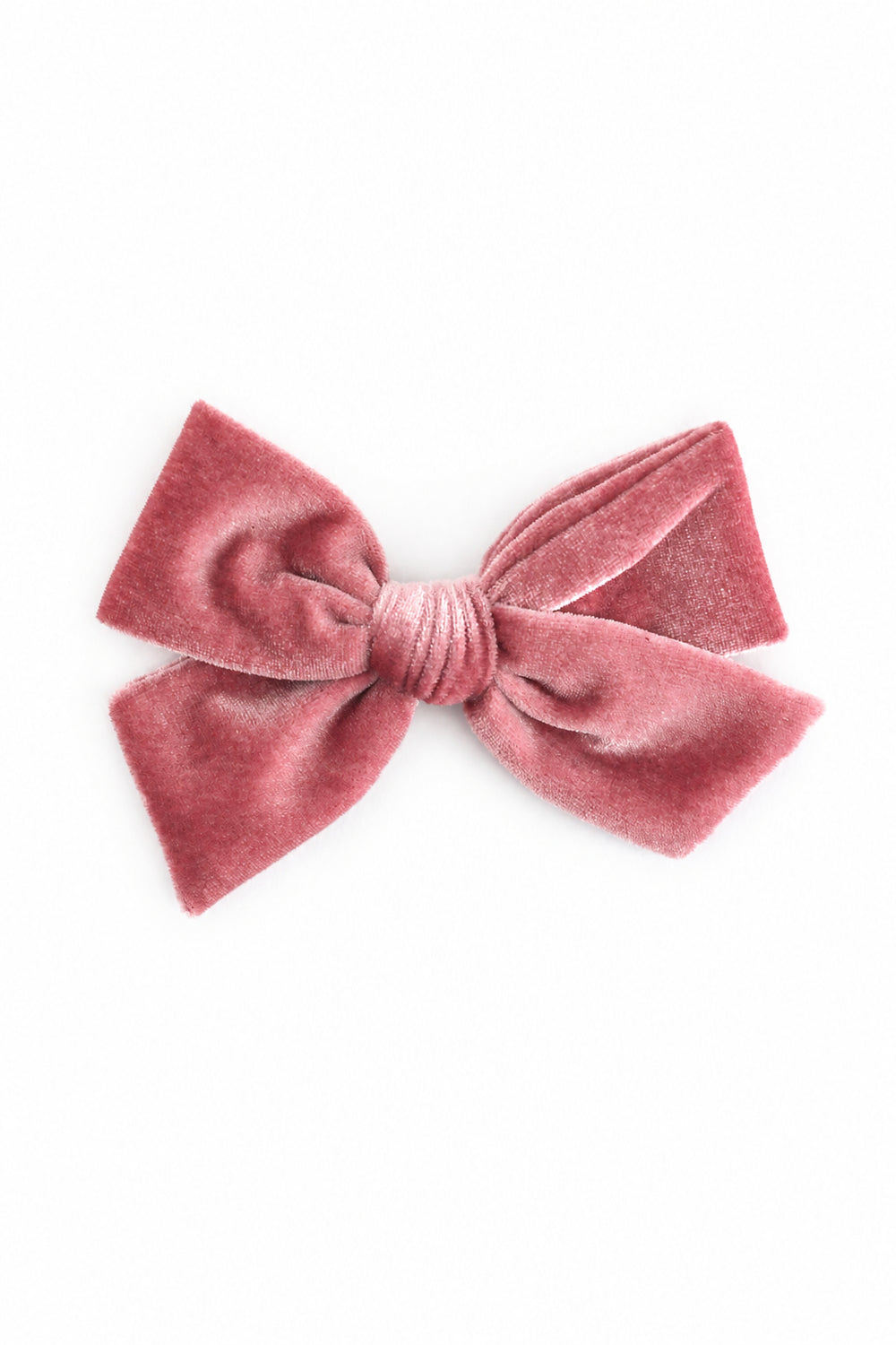 A dusty rose velvet bow hair clip on a clean white background.