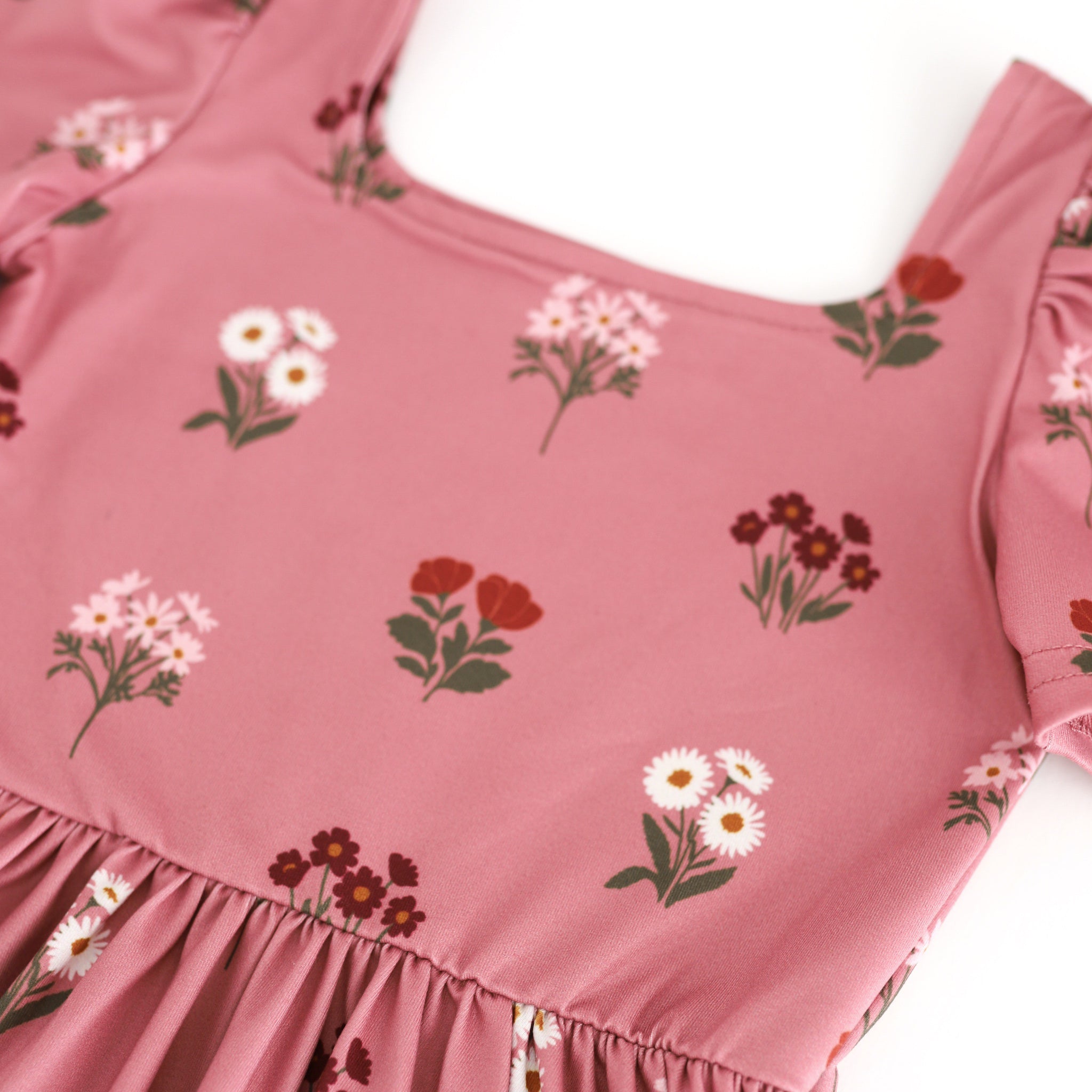 detail photo of square neck twirl bodice in light mauve with burgundy, ivory and rust flower bouquets