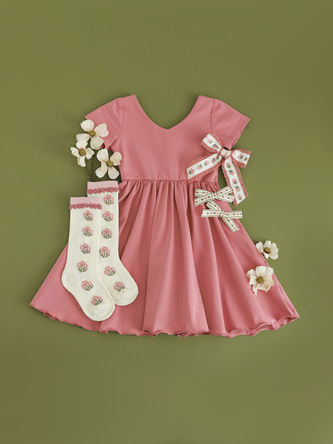 girls rosy pink v-neck twirl dress with matching pink and ivory floral socks and bows for fall