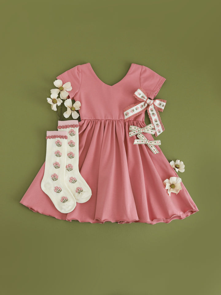 girls rosy pink v-neck twirl dress with matching pink and ivory floral socks and bows for fall