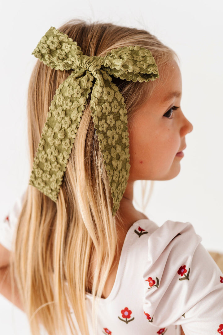 olive green textured floral hair bow on little girl
